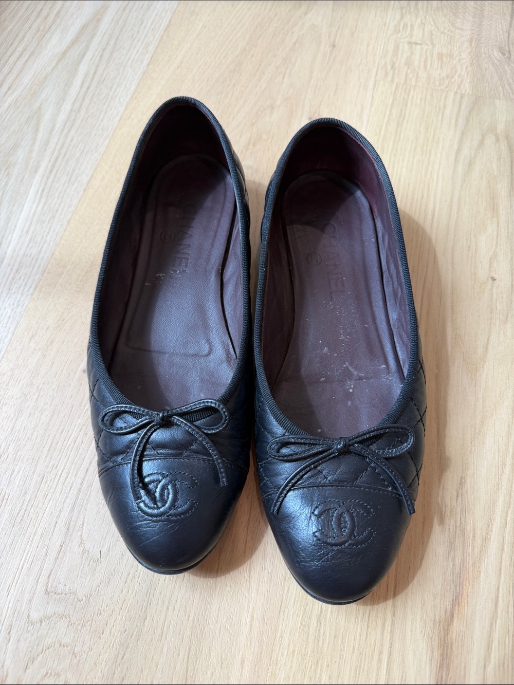 CHANEL Black Quilted Leather Bow Ballet Flats with CC Logo
